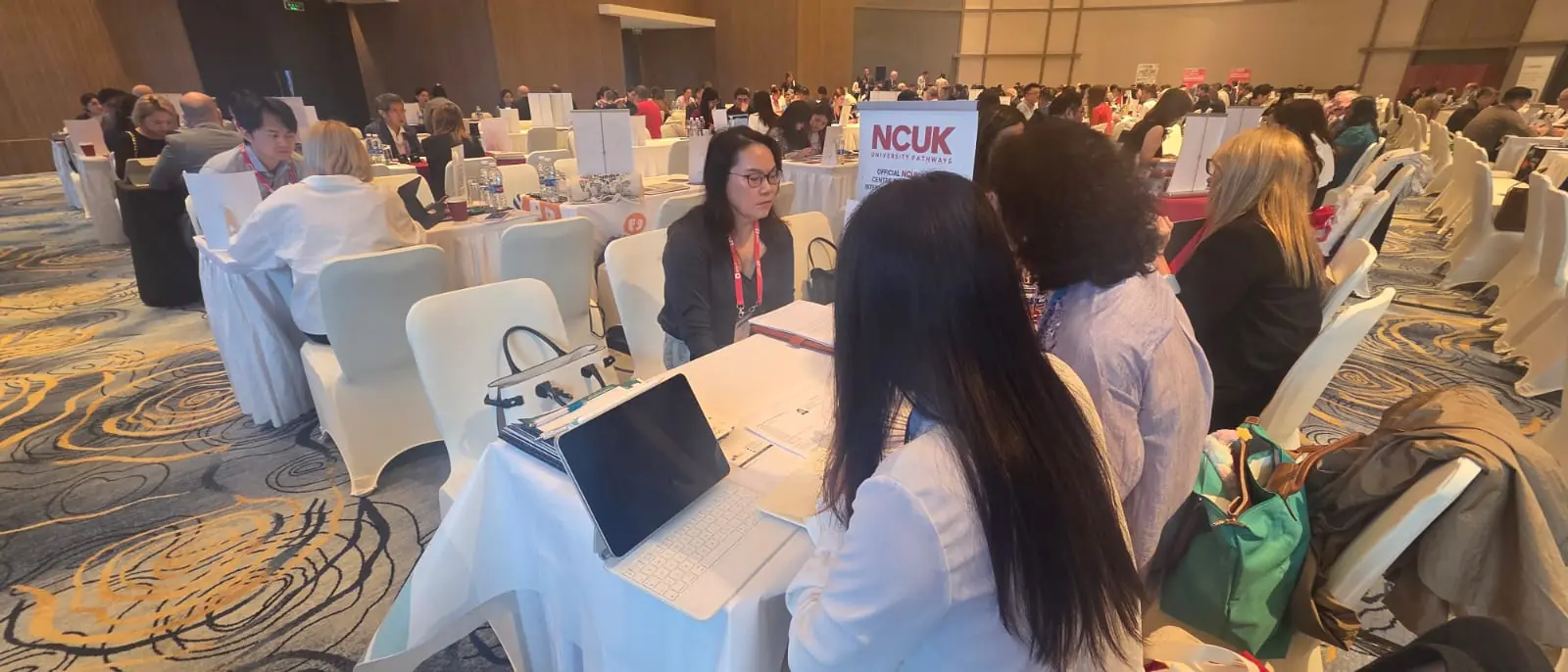 Students and staff networking at the NCUK study centre conference